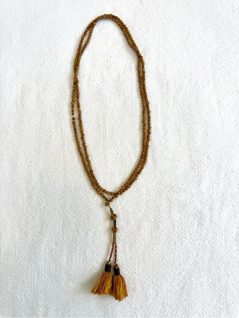 Meditation Beads: Knotted Chord with Small Beaded Sections and Tassels.